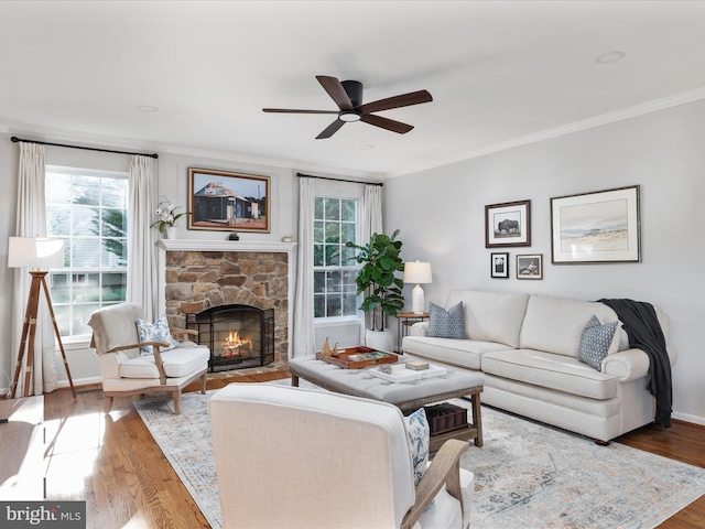 35513 Sourwood Pl, Round Hill, VA 20141 - living area with plenty of natural light, ceiling fan, wood finished floors, a fireplace, and crown molding