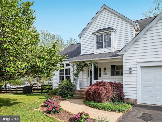 35513 Sourwood Pl, Round Hill, VA 20141 - view of front facade featuring covered porch, a shingled roof, and an attached garage