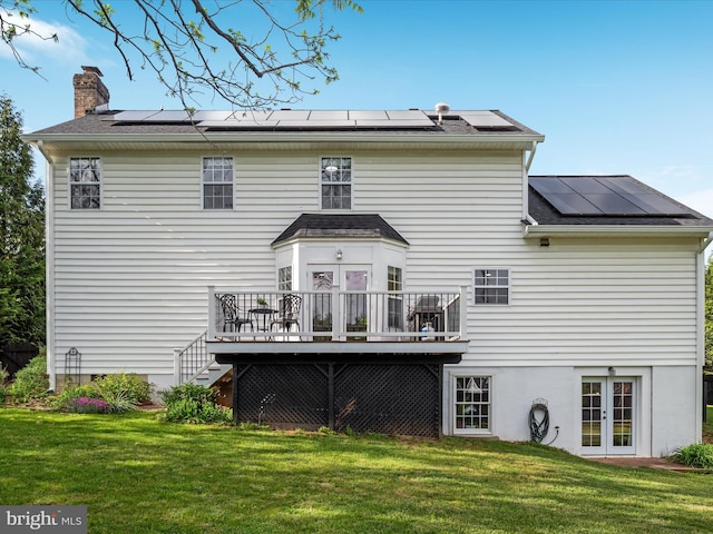 35513 Sourwood Pl, Round Hill, VA 20141 - back of property with french doors, solar panels, and a lawn