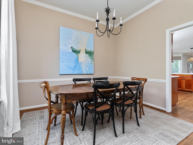 35513 Sourwood Pl, Round Hill, VA 20141 - dining space featuring light wood-style flooring, ornamental molding, baseboards, and a chandelier