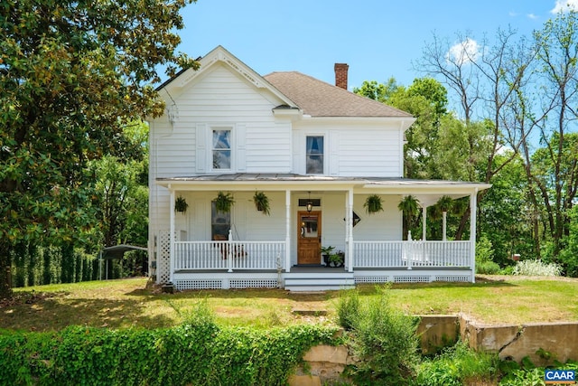 2010 White Bridge Rd, Waynesboro, VA 22980 - view of front of home with a chimney, roof with shingles, covered porch, a standing seam roof, and a front yard