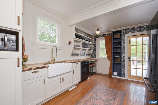 2010 White Bridge Rd, Waynesboro, VA 22980 - kitchen with black appliances, crown molding, a sink, light wood-style flooring, and white cabinets