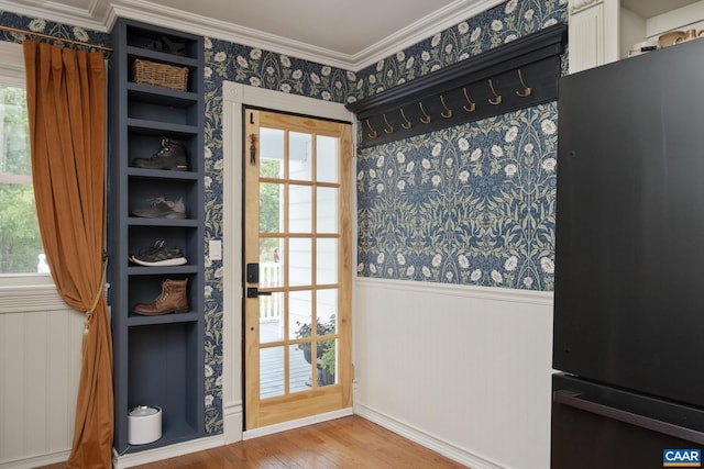 2010 White Bridge Rd, Waynesboro, VA 22980 - doorway to outside with wallpapered walls, crown molding, healthy amount of natural light, a wainscoted wall, and wood finished floors