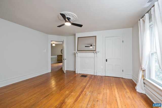 2010 White Bridge Rd, Waynesboro, VA 22980 - unfurnished bedroom featuring light wood-type flooring, ceiling fan, baseboards, and radiator heating unit