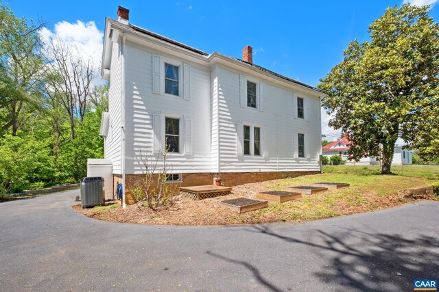 2010 White Bridge Rd, Waynesboro, VA 22980 - view of side of home featuring a chimney and central air condition unit