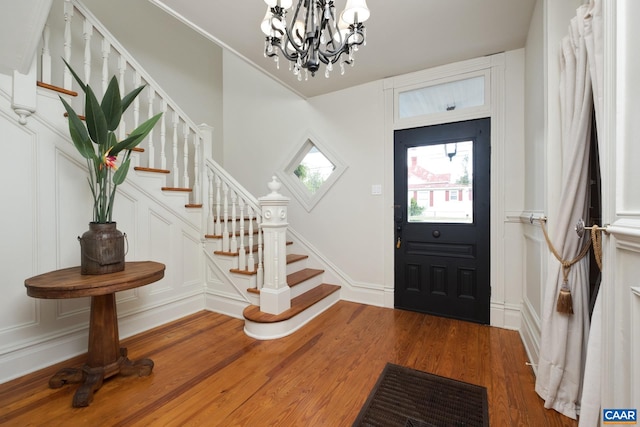 2010 White Bridge Rd, Waynesboro, VA 22980 - foyer entrance with stairs, a chandelier, a decorative wall, and wood finished floors