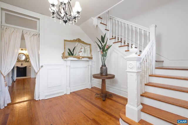 2010 White Bridge Rd, Waynesboro, VA 22980 - staircase with a decorative wall, a chandelier, and wood finished floors