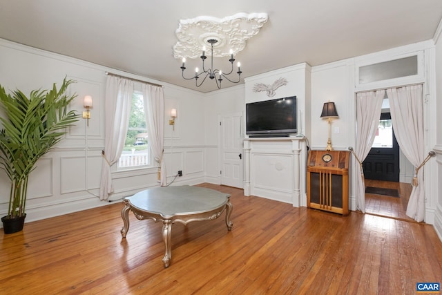 2010 White Bridge Rd, Waynesboro, VA 22980 - living area featuring a decorative wall, healthy amount of natural light, a chandelier, and light wood-type flooring