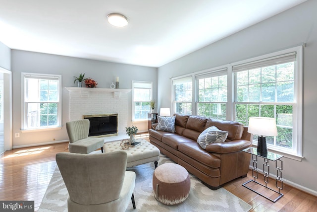 12685 Fox Woods Dr, Herndon, VA 20171 - living area with baseboards, hardwood / wood-style flooring, and a fireplace