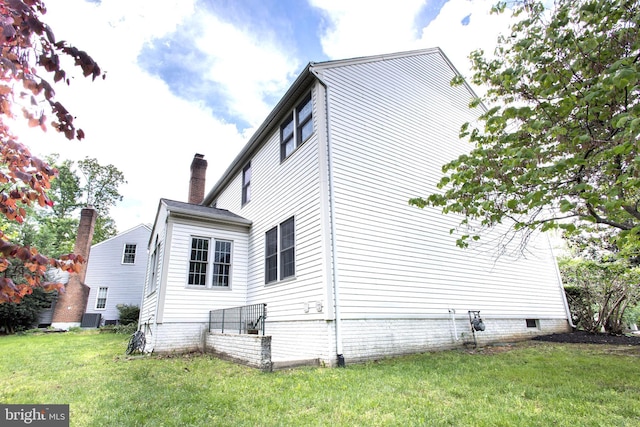 12685 Fox Woods Dr, Herndon, VA 20171 - view of side of property featuring a lawn and central AC