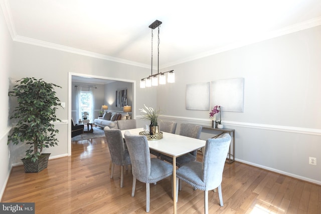 12685 Fox Woods Dr, Herndon, VA 20171 - dining space with wood finished floors, ornamental molding, and baseboards