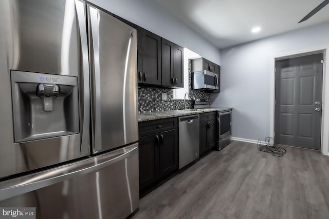550 N 58th St, Philadelphia, PA 19131 - kitchen featuring stainless steel appliances, light wood-style floors, tasteful backsplash, baseboards, and recessed lighting