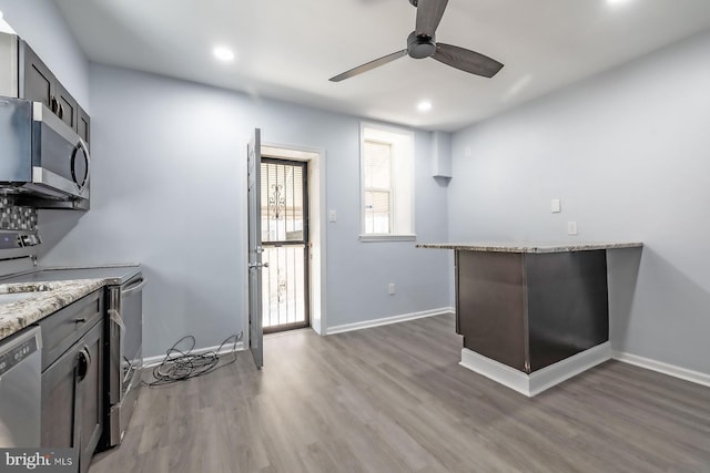 550 N 58th St, Philadelphia, PA 19131 - kitchen with stainless steel appliances, a ceiling fan, light wood-style floors, recessed lighting, and baseboards
