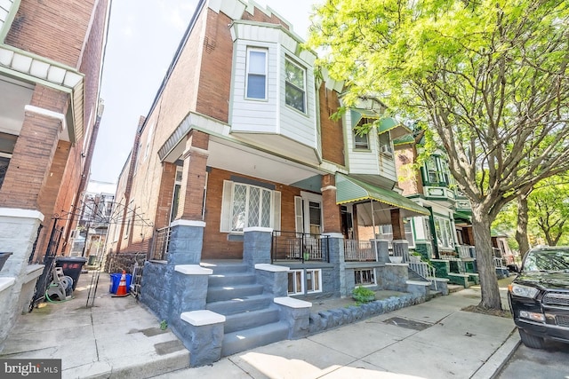 550 N 58th St, Philadelphia, PA 19131 - multi unit property featuring covered porch and brick siding