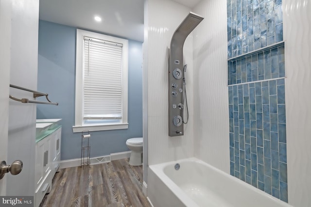 550 N 58th St, Philadelphia, PA 19131 - bathroom featuring toilet, wood finished floors, vanity, baseboards, and tub / shower combination