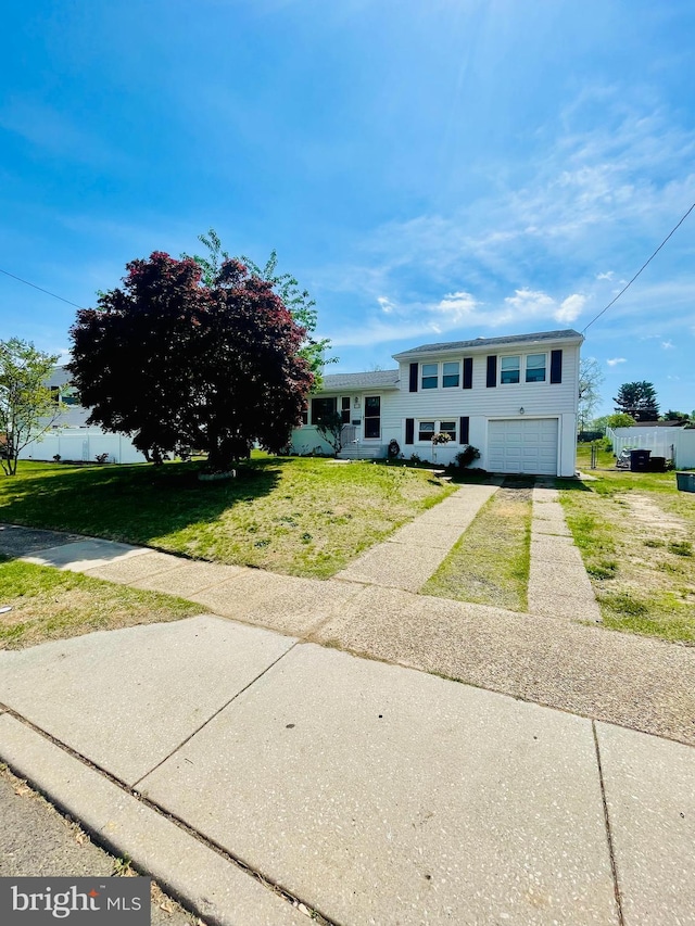 218 Hendrickson Ave, Beverly, NJ 08010 - split level home featuring driveway, a garage, and a front lawn