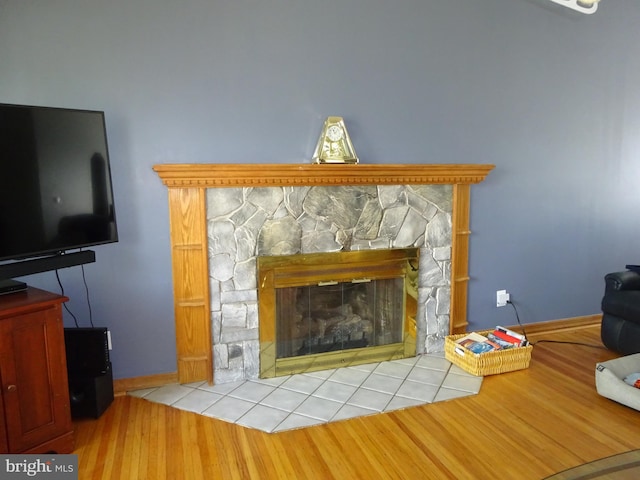 218 Hendrickson Ave, Beverly, NJ 08010 - detailed view of wood finished floors, baseboards, and a stone fireplace
