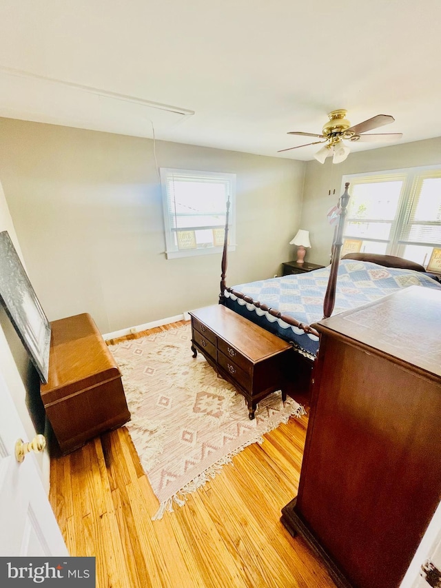 218 Hendrickson Ave, Beverly, NJ 08010 - bedroom featuring attic access, multiple windows, wood finished floors, and a ceiling fan