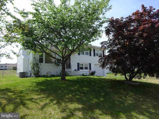 218 Hendrickson Ave, Beverly, NJ 08010 - view of front facade featuring central air condition unit and a garage