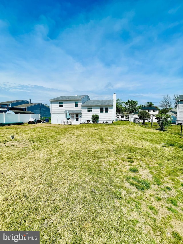 218 Hendrickson Ave, Beverly, NJ 08010 - rear view of property featuring a chimney