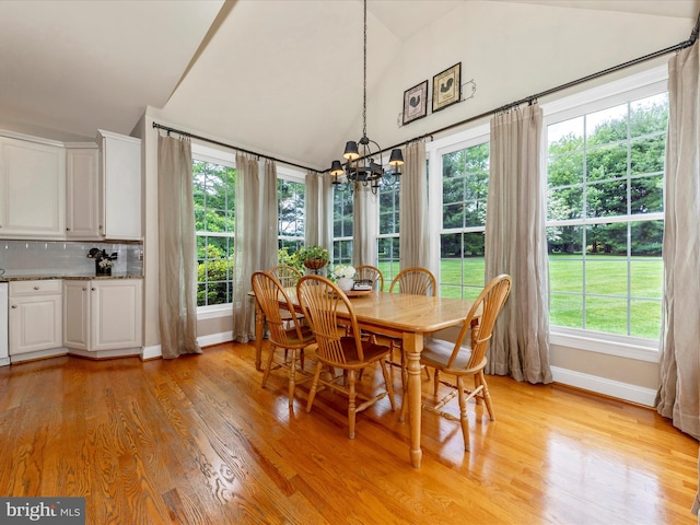 16013 Pheasant Ridge Ct, Woodbine, MD 21797 - dining space featuring a chandelier, baseboards, plenty of natural light, light wood finished floors, and high vaulted ceiling