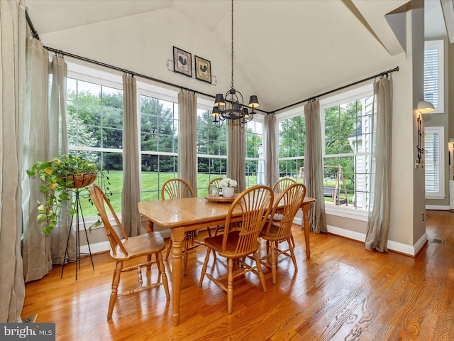 16013 Pheasant Ridge Ct, Woodbine, MD 21797 - dining space with lofted ceiling, a chandelier, baseboards, and light wood-style flooring