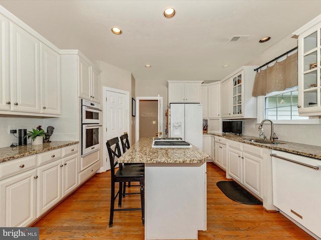 16013 Pheasant Ridge Ct, Woodbine, MD 21797 - kitchen with a sink, tasteful backsplash, white appliances, a center island, and recessed lighting