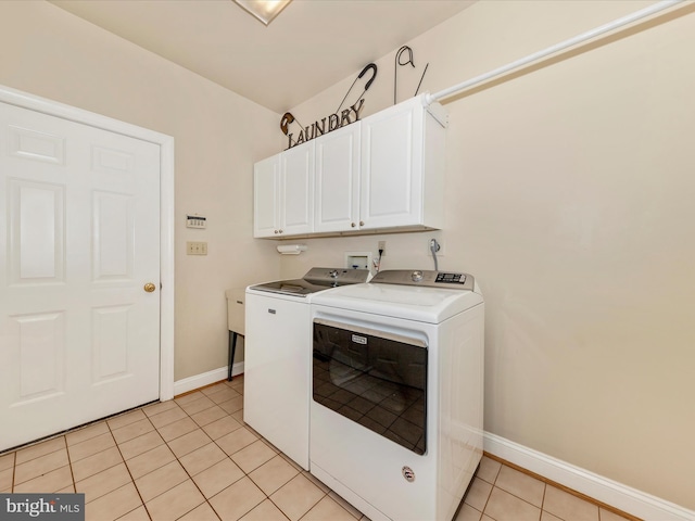 16013 Pheasant Ridge Ct, Woodbine, MD 21797 - laundry area with separate washer and dryer, cabinet space, light tile patterned flooring, and baseboards