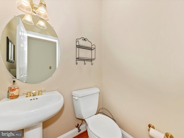16013 Pheasant Ridge Ct, Woodbine, MD 21797 - bathroom featuring toilet, a sink, and baseboards