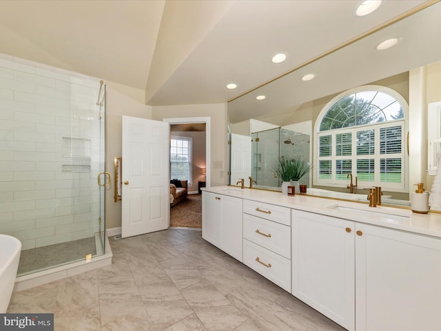16013 Pheasant Ridge Ct, Woodbine, MD 21797 - bathroom with double vanity, recessed lighting, a stall shower, marble look tiles, and vaulted ceiling