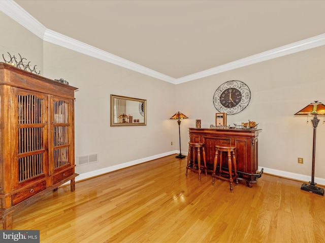 16013 Pheasant Ridge Ct, Woodbine, MD 21797 - sitting room with crown molding, a dry bar, baseboards, and wood finished floors