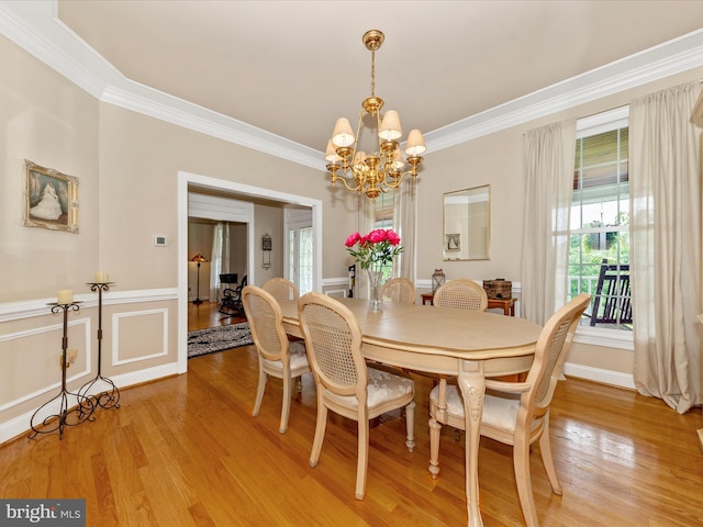 16013 Pheasant Ridge Ct, Woodbine, MD 21797 - dining room with light wood-style floors, a chandelier, and ornamental molding