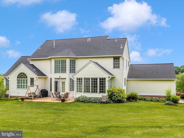 16013 Pheasant Ridge Ct, Woodbine, MD 21797 - rear view of house featuring a patio, a yard, and a shingled roof