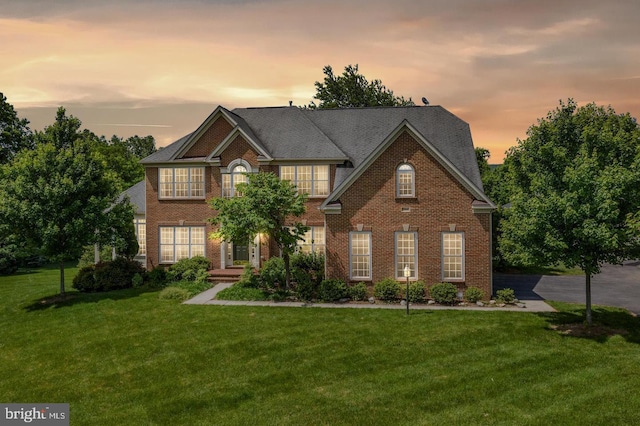 17301 Roundmont Pl, Round Hill, VA 20141 - colonial house with brick siding and a front yard