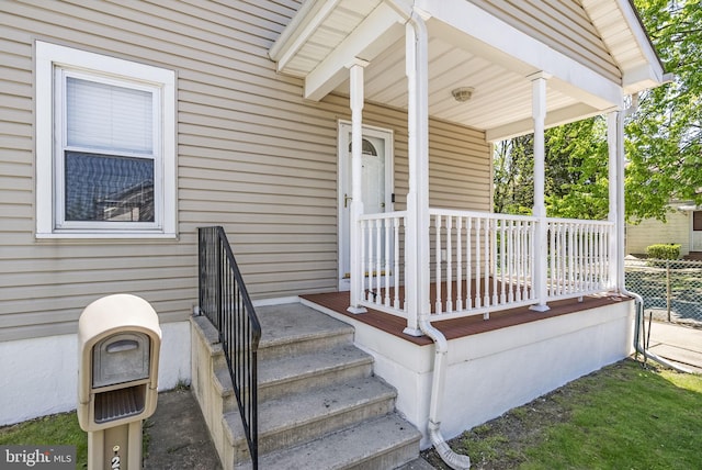 entrance to property with a porch