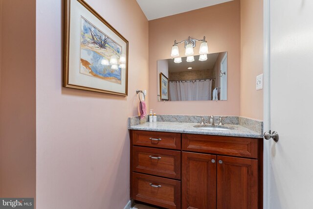 bathroom with vanity and a shower with shower curtain