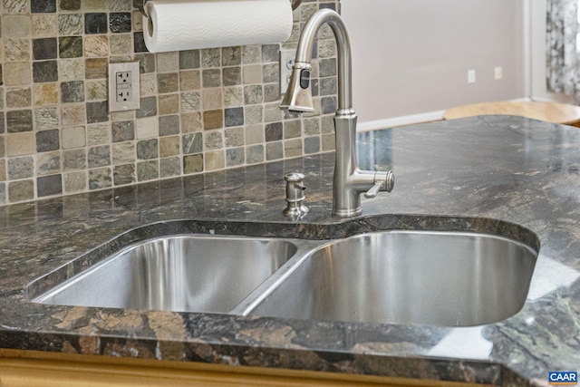 kitchen view of a sink and backsplash