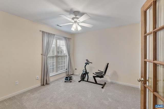 workout room with carpet floors, ceiling fan, and baseboards