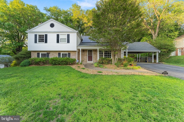 13429 Locksley Ln, Silver Spring, MD 20904 - split level home featuring a front lawn, a carport, asphalt driveway, and brick siding