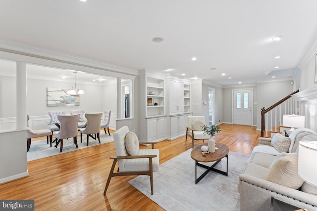 13429 Locksley Ln, Silver Spring, MD 20904 - living room with crown molding, stairway, light wood-style floors, a chandelier, and recessed lighting