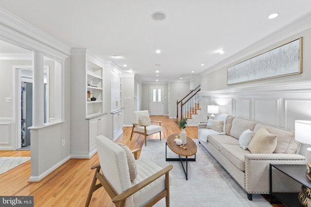 13429 Locksley Ln, Silver Spring, MD 20904 - living area featuring stairs, ornamental molding, light wood-style flooring, recessed lighting, and wainscoting