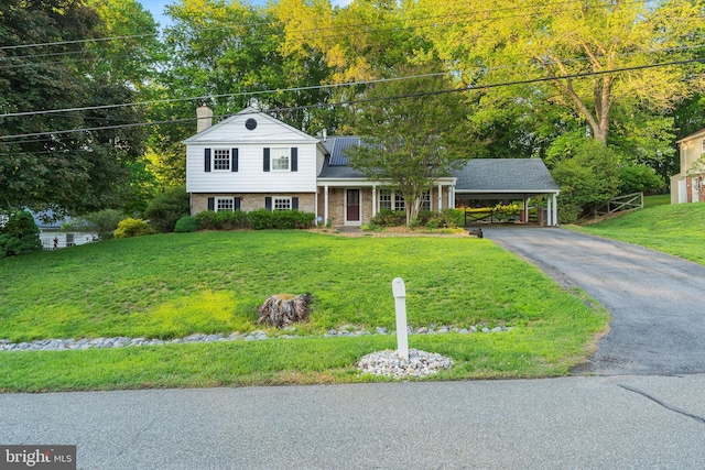 13429 Locksley Ln, Silver Spring, MD 20904 - split level home featuring driveway, a chimney, a front lawn, and brick siding