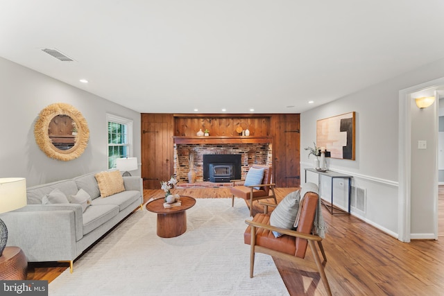 13429 Locksley Ln, Silver Spring, MD 20904 - living room featuring light wood-style flooring, recessed lighting, a wood stove, and baseboards