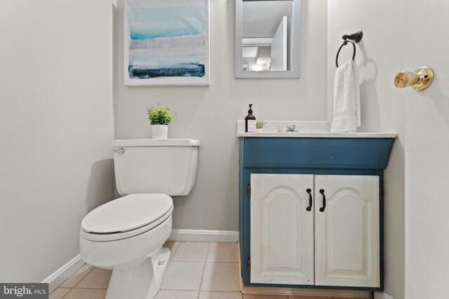 13429 Locksley Ln, Silver Spring, MD 20904 - half bathroom with baseboards, toilet, vanity, and tile patterned flooring