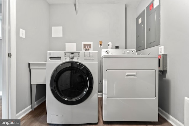 13429 Locksley Ln, Silver Spring, MD 20904 - laundry room featuring washer and clothes dryer, baseboards, and wood finished floors