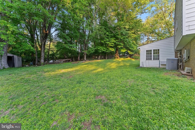 13429 Locksley Ln, Silver Spring, MD 20904 - view of green lawn featuring central AC, an outdoor structure, and a shed