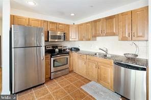 901 N Penn St Unit P507, Philadelphia, PA 19123 - kitchen with appliances with stainless steel finishes, tile patterned flooring, dark countertops, and recessed lighting