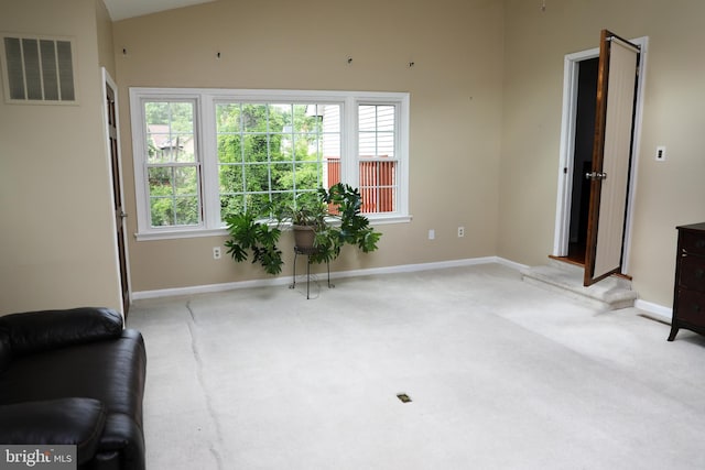 2616 Osage St, Hyattsville, MD 20783 - carpeted living area featuring baseboards and lofted ceiling
