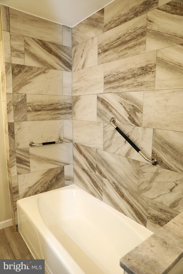 2616 Osage St, Hyattsville, MD 20783 - bathroom with wood finished floors and shower / bath combination