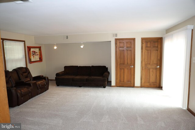 2616 Osage St, Hyattsville, MD 20783 - carpeted living room with track lighting and baseboards